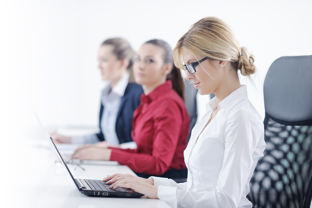 Female staff working on laptops